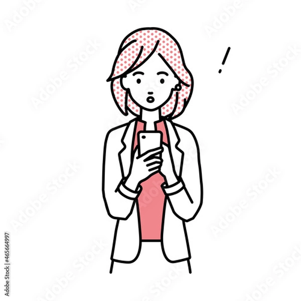 Fototapeta 立ってスマートフォンを操作して何かに気づいて驚いたジャケットの女性