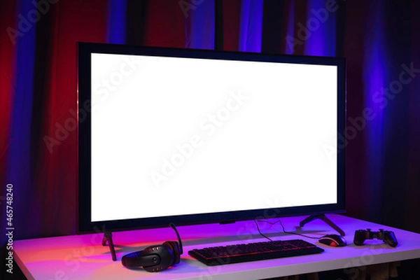 Fototapeta Blank screen display computer pc with gaming gear joystick mouse keyboard mouse. Gamer gadget background in game station.