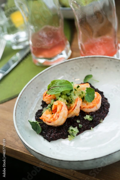 Obraz Black risotto with roasted shrimps