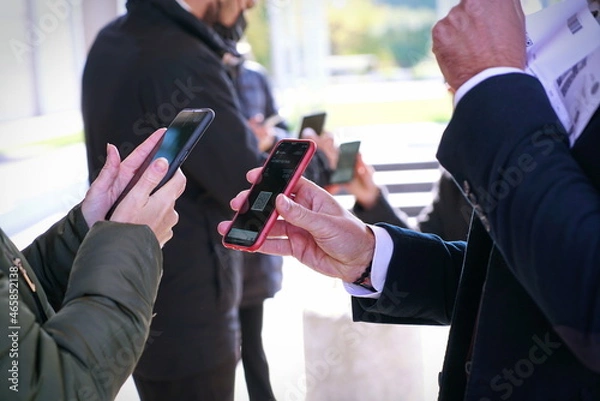 Fototapeta Checking the green pass on a smartphone, required for entry to an exhibition event. Selective focus.  Rimini, Italy - October 2021