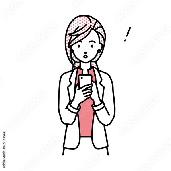 Fototapeta 立ってスマートフォンを操作して何かに気づいて驚いたジャケットの女性