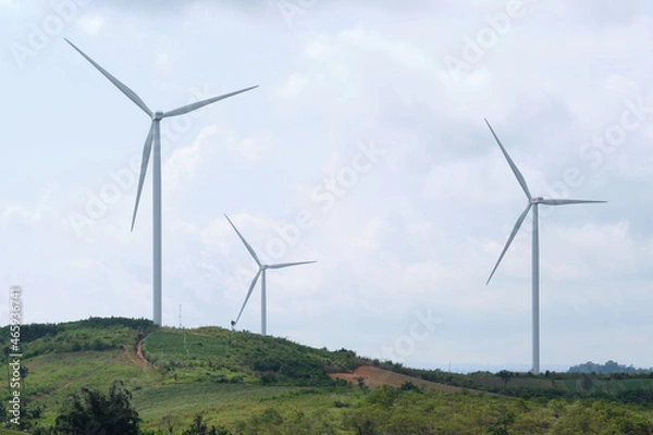 Fototapeta View of a windmill or Wind turbine farm . Renewable energy source. Electricity production .