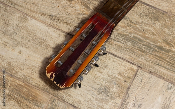 Fototapeta the head of the neck from an old guitar