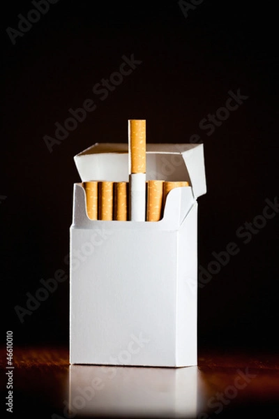 Obraz Pack of cigarettes isolated on black background,small depth of f