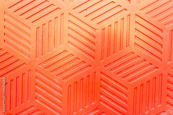 Obraz Red plastic surface with repetitive geometric shapes. Seamless geometrical patterns with rhombuses, lines and corners. Stamped plastic surface with simple geometric lines. Space for inserting text