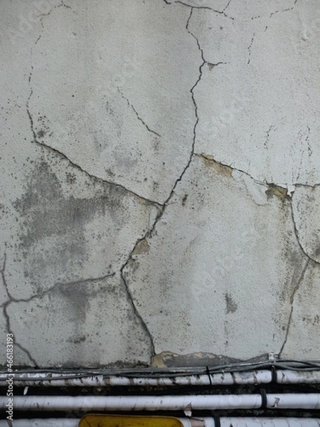 Obraz ひび割れた壁と劣化したケーブル
