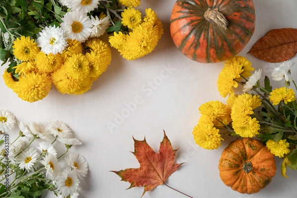 Fototapeta Autumn composition. Frame made of fresh yellow flowers, pumpkin and leaves. Autumn, fall concept. Flat lay, top view, copy space