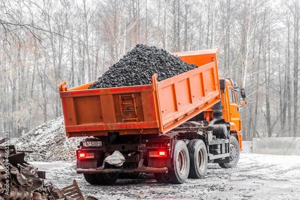 Obraz Dump truck in the industrial zone unloads coking coal from the body