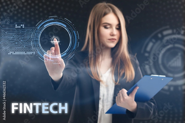 Fototapeta Business, Technology, Internet and network concept. Young businessman working on a virtual screen of the future and sees the inscription: Fintech