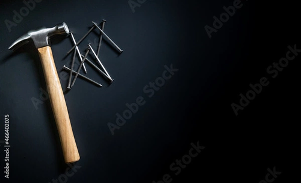 Obraz hammer and nails on black background