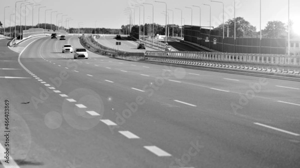 Fototapeta View on a concrete highway. Modern highway safety markings on concrete. Black end white.