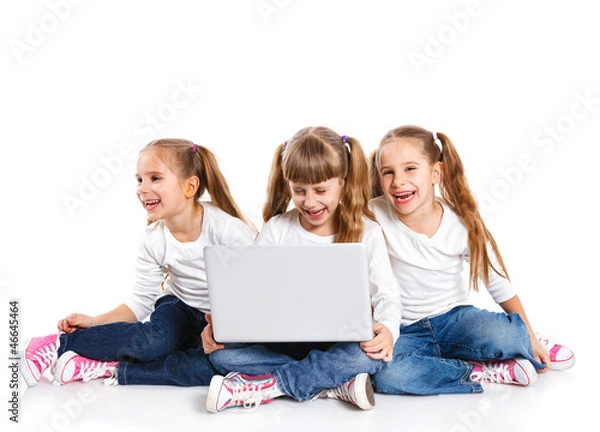 Fototapeta Three attractive girl using a laptop