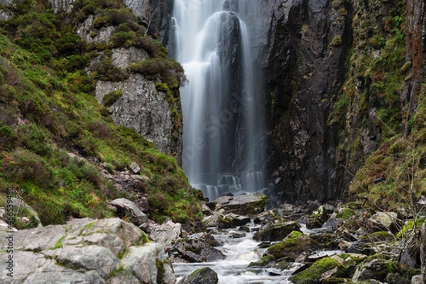 Fototapeta Wailing Widow Falls in Assynt, North West Highlands of Scotland. Falls with smoothed water, stream, rocks, cliffs either side with greenery. No people.