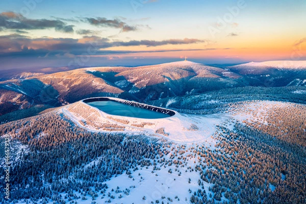 Obraz Pumped storage hydro plant "Dlouhe strane" in Jeseniky mountains during sunset. Aerial view on evening winter mountains. Third biggest pumped storage hydro plant in the world