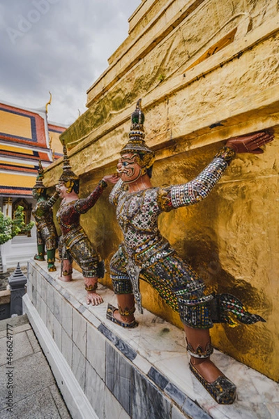 Obraz Many Giant statues are around the base of the pagoda at the grand palace the Temple of the Emerald Buddha.