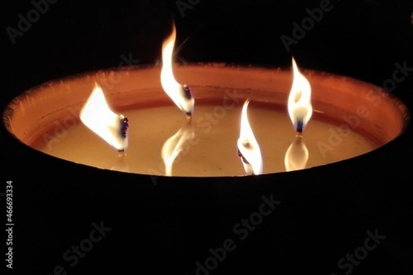 Obraz burning candle in the dark