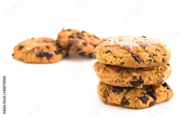 Fototapeta cookies with chocolate and hazelnuts on a white background