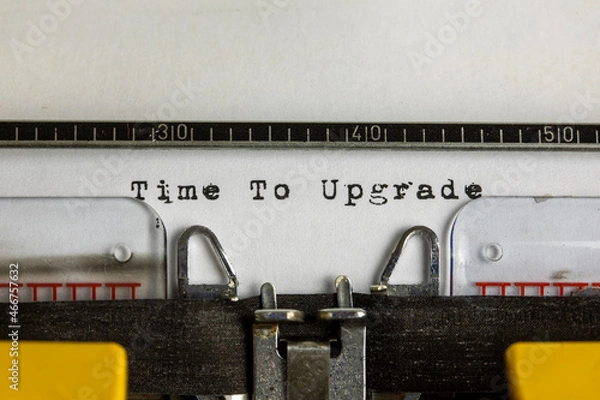 Fototapeta Time to upgrade written on an old typewriter