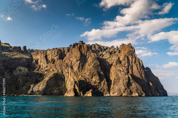 Fototapeta The Crimean Peninsula. July 21, 2021. Picturesque view of the high cliffs at Cape Karagach from the Black Sea.