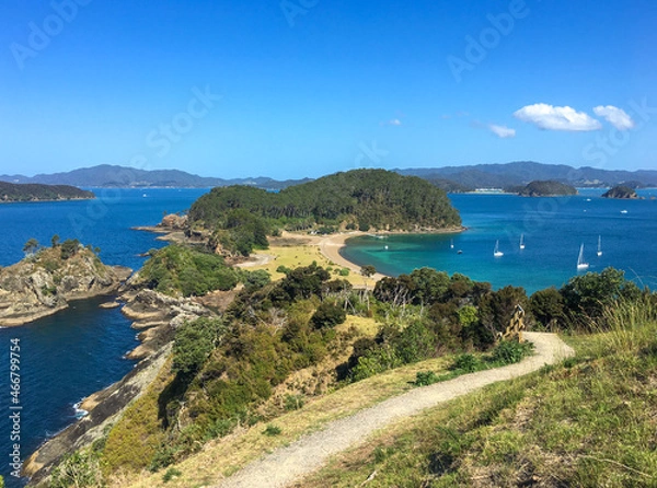 Fototapeta View from the track at top of Roberton Island, boats in the bay, blue skies, summer, Bay of Islands, NZ