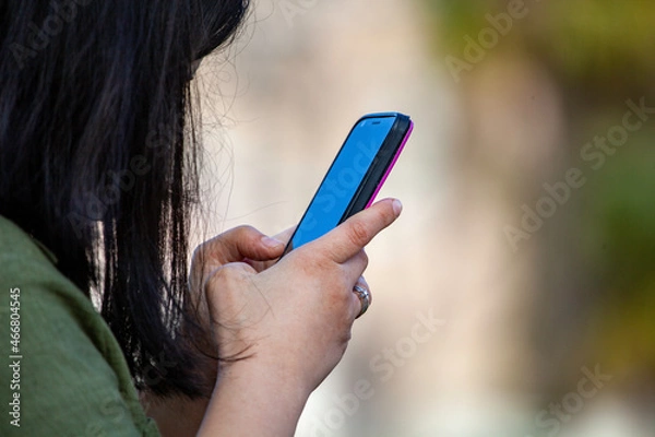 Obraz person using a mobile phone