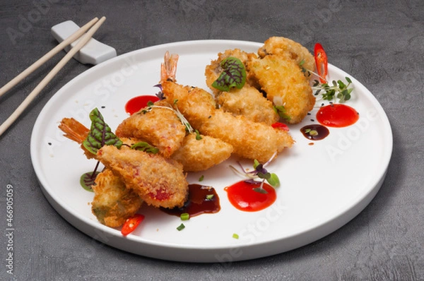 Obraz breaded shrimp and vegetables with hot sauce