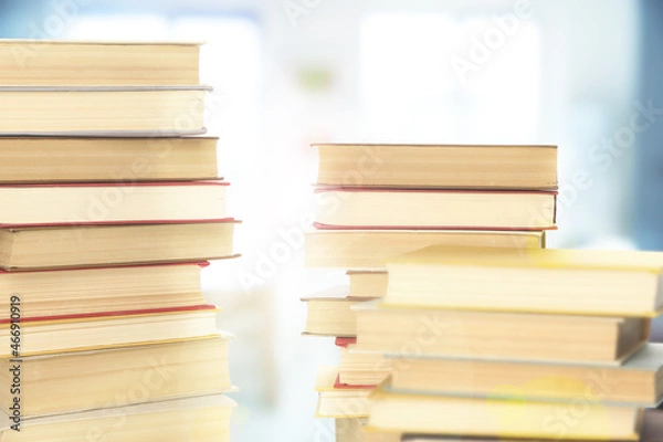 Fototapeta Stacks of books indoors. Bokeh effect