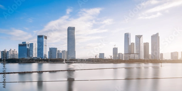 Fototapeta Early morning scenery of CBD city along the Minjiang River in Fuzhou, Fujian, China