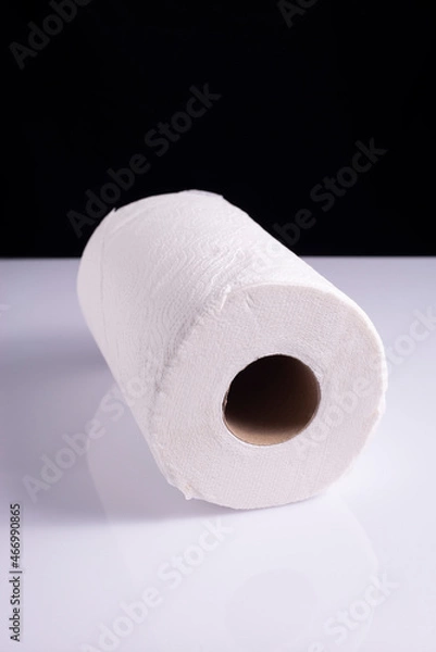 Fototapeta roll of white paper towels napkins on white table