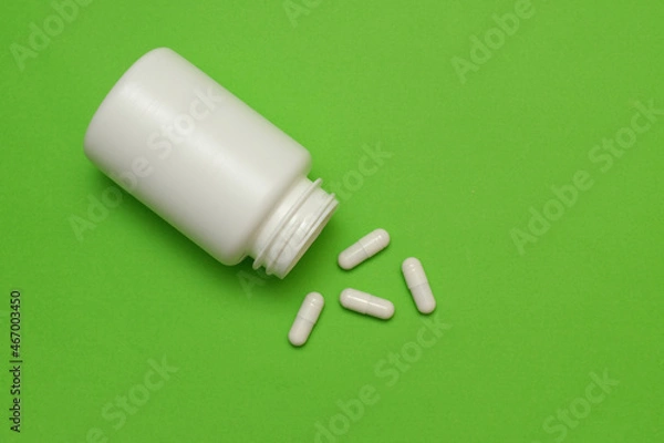 Fototapeta plastic white bottle with pills