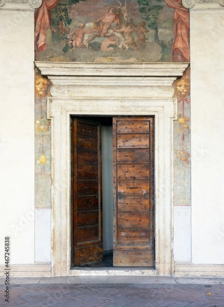 Fototapeta Wooden doorway and frescoes at Villa Giulia, Rome, 2021.