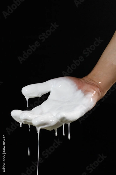 Obraz an open palm with a flowing liquid