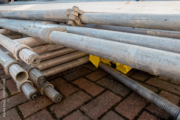 Fototapeta Pile of components of hired scaffolding or mobile platform work tower