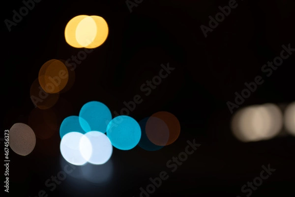 Fototapeta bokeh ronds de lumière chaude bleue jaune blanche sur fond noir