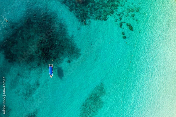 Fototapeta aerial view of boat not far from island beach