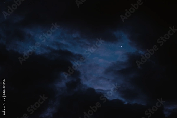 Fototapeta Stars in the night sky bring the clouds together