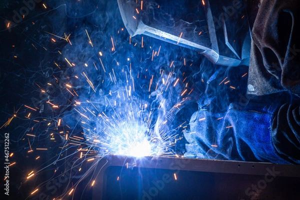 Fototapeta welder uses torch
