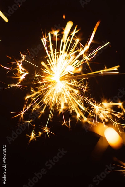 Obraz a sparkler on black background