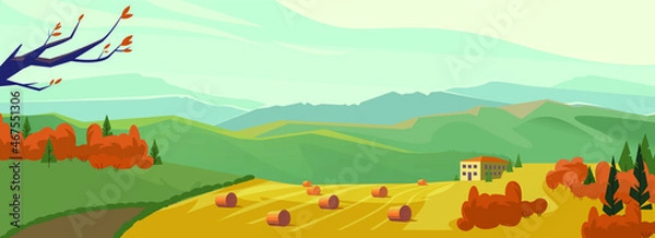 Fototapeta Golden field with round hay bales against the mountains and a picturesque cloudy sky on a perfect autumn day. Haystack on the meadow in autumn.  