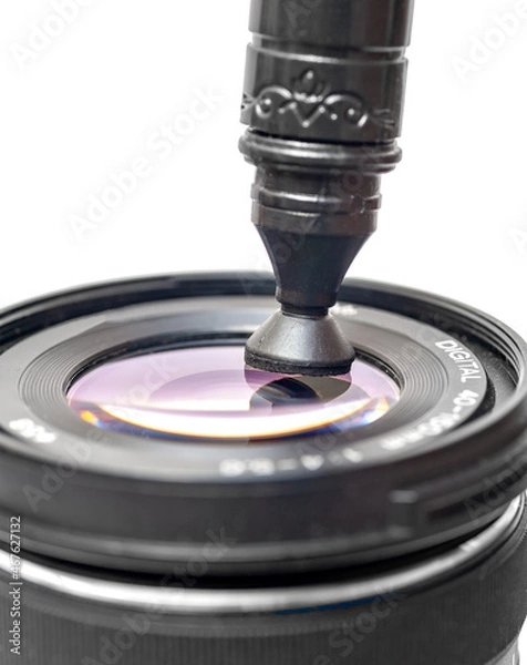 Obraz camera lens cleaning through lenspen on white background
