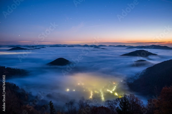 Obraz street lights shining through the fog