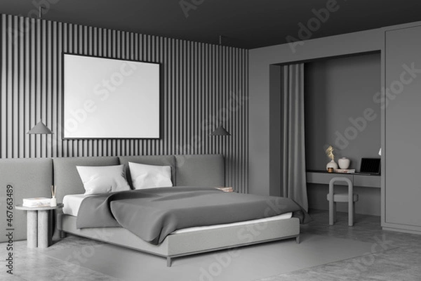 Fototapeta Corner of grey bedroom with niche desk and horizontal canvas