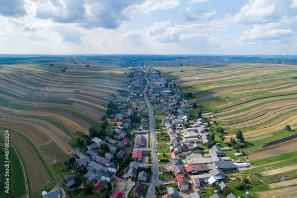 Fototapeta Village, amazing in Poland from a bird's eye view from a drone. Sułoszowa - the longest village from the drone.