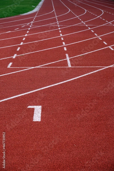 Fototapeta Red running track in sport stadium