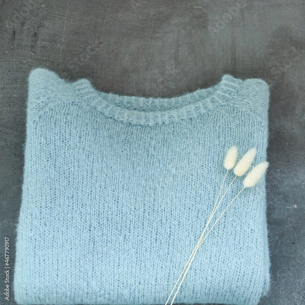 Obraz Blue knitted sweater handmade isolated gray backround