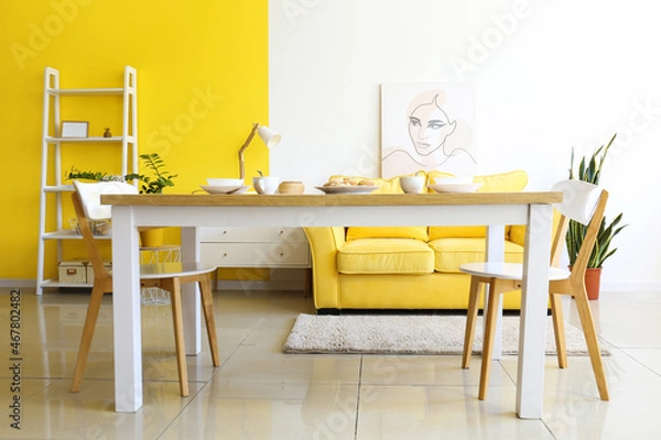 Fototapeta Dining table with cookies in interior of bright room