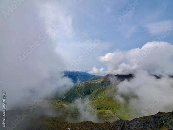 Fototapeta mountains in clouds
