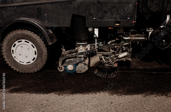 Fototapeta Cleaning machine washes asphalt