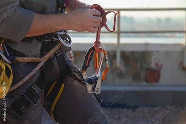 Obraz Unrecognizable climber man wearing in safety harness