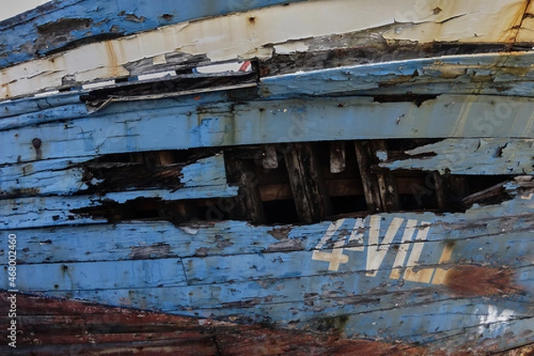 Fototapeta  hull of a wooden ship worn by the passage of time.  